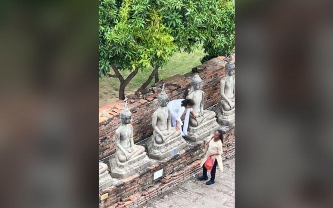 Kultureller Fehltritt: Indische Touristen klettern auf Buddha-Statue, um Mangos zu pflücken - Video