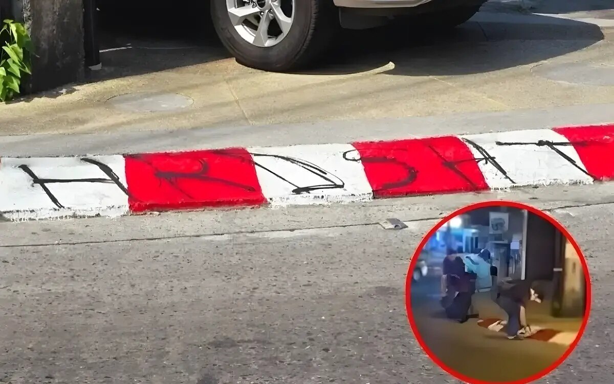 Zwei auslaendische maenner bespruehen den fussweg in phuket thais empoert video